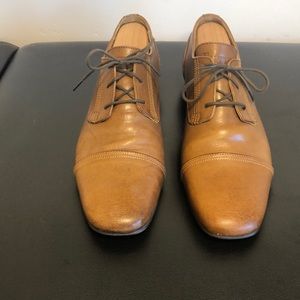 Men’s brown John Fluevog cap toe dress shoes size 10. Like new (worn minimally).
